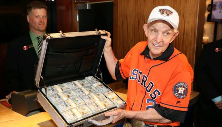 mattress-mack-holding-case-of-cash